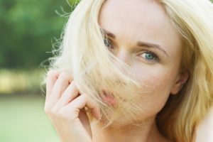 Woman covering face with hair, portrait, Image: 295623499, License: Rights-managed, Restrictions: , Model Release: no, Credit line: Profimedia, PhotoAlto