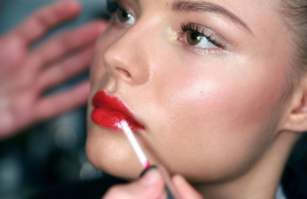 WD 1189-102 . Valentino. Backstage Paris Ready to Wear. Spring/Summer 2007. Bright red shimmering lipstick being applied on female , in semi-profile. ., Image: 221449630, License: Rights-managed, Restrictions: FOR EDITORIAL USE ONLY, Model Release: no, Credit line: Profimedia, TEMP Camerapress